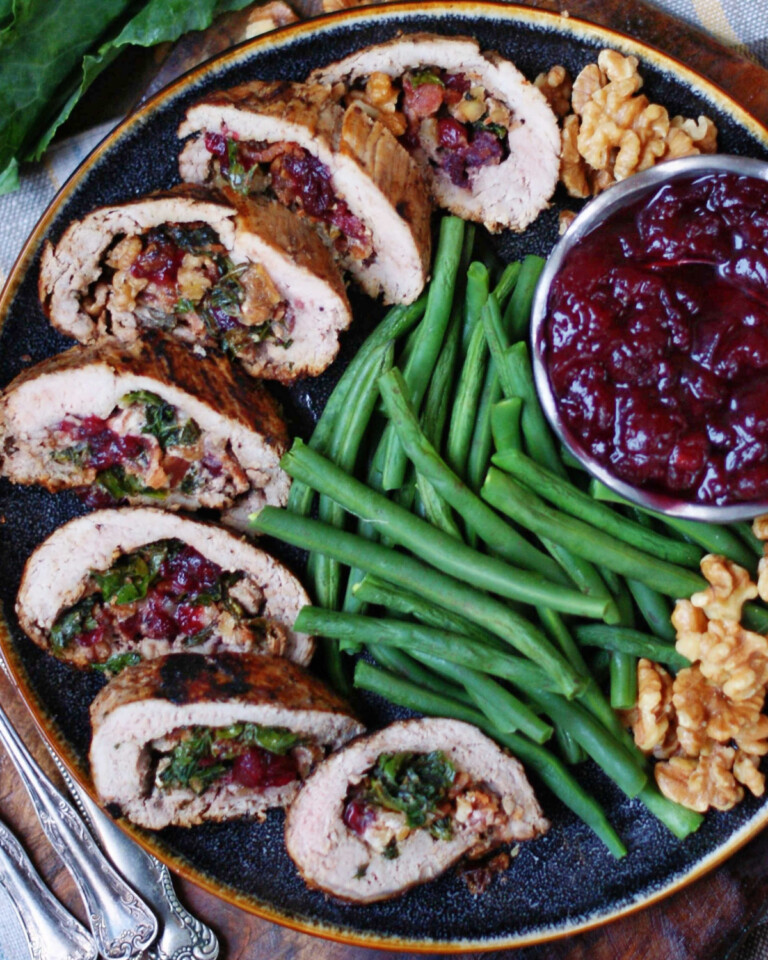 Cranberry Bacon Walnut Stuffed Pork Tenderloin with Collard Greens