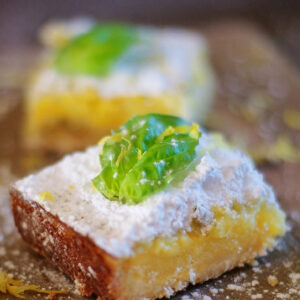 Old fashioned lemon squares with buttery shortbread crust and a fresh basil twist.