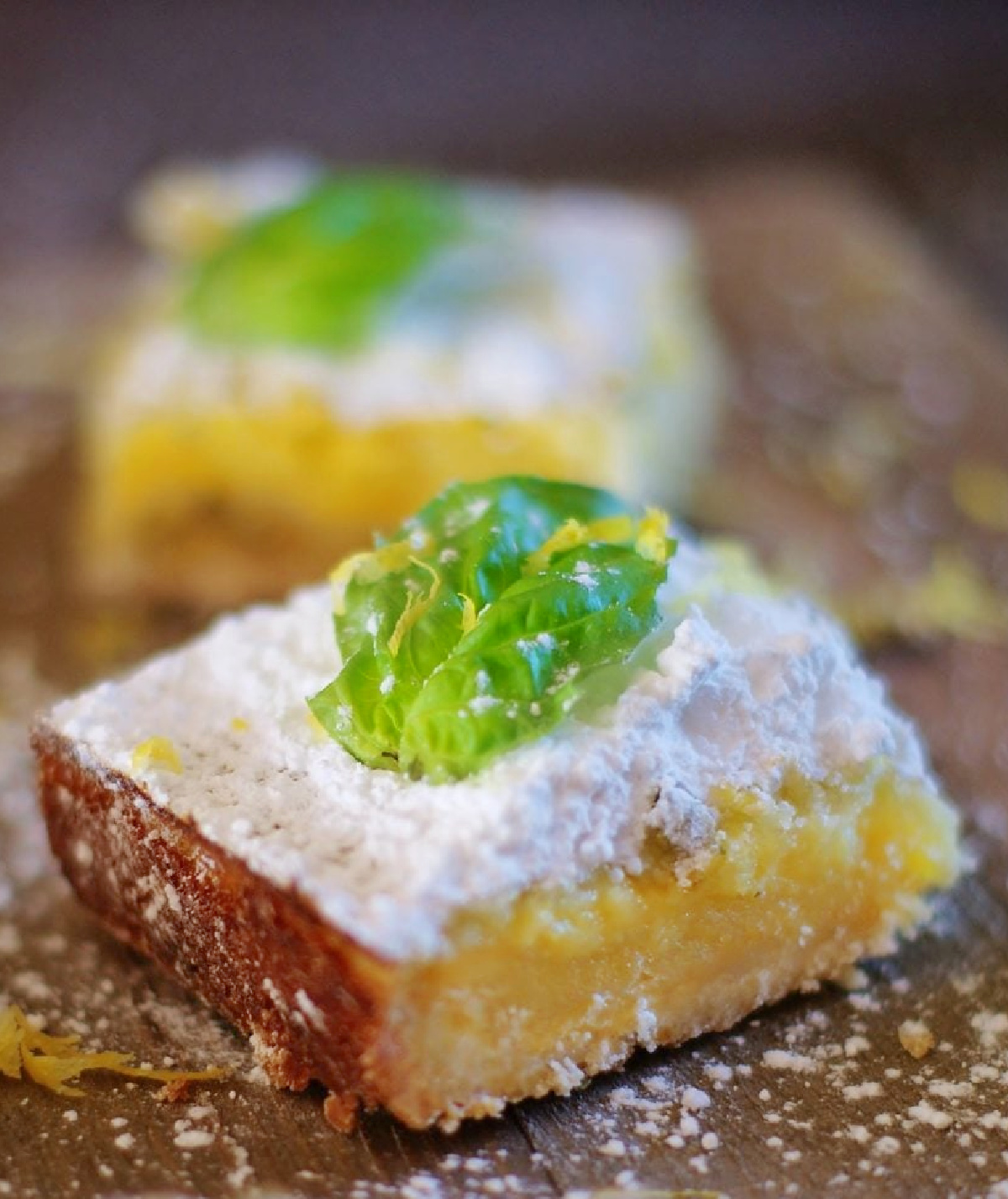 Old fashioned lemon squares with buttery shortbread crust and a fresh basil twist.