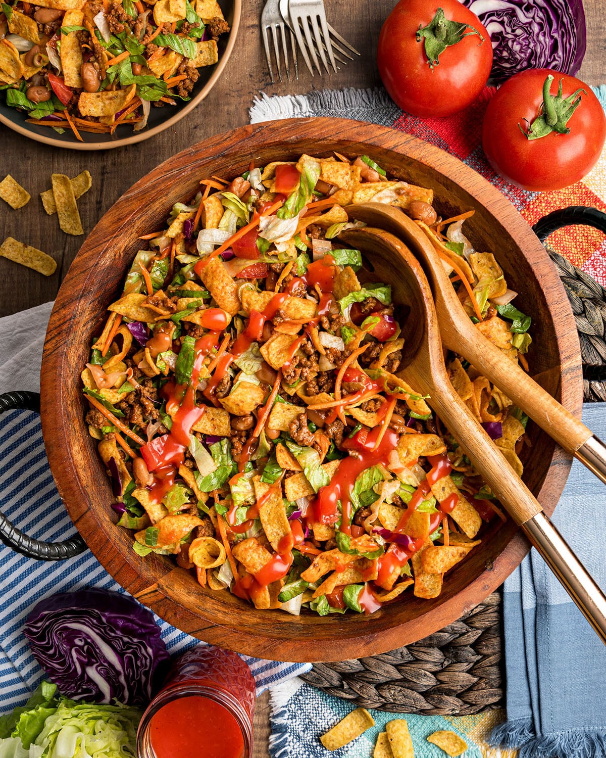 A bowl of Catalina Taco Salad with Fritos with a drizzle of classic salad dressing across the top.