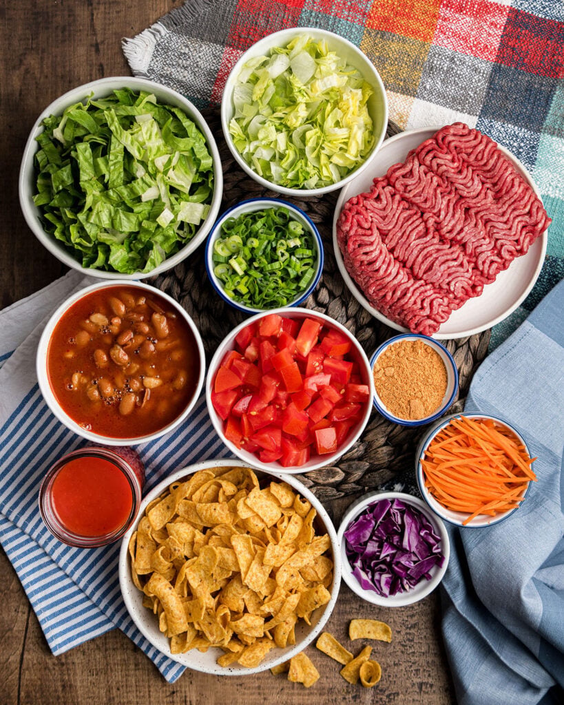 Ingredients for a classic Catalina Salad including Fritos corn chips, pinto beans and romaine lettuce.