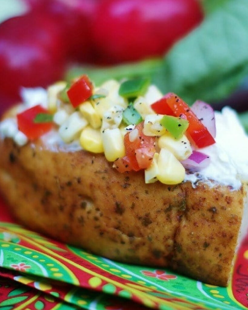 Sweet corn relish with cream cheese on bread as an appetizer.