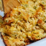 A scoop of cornbread dressing to show texture and vegetables in the finsihed casserole.