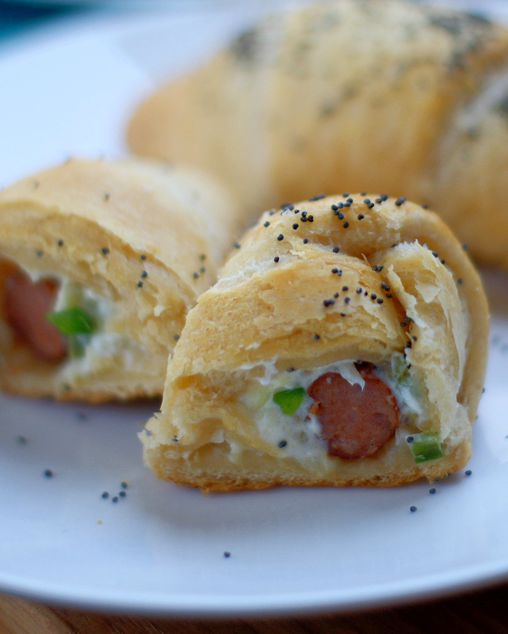 Upclose of cut open Hawaiian Popper Crescent Roll
