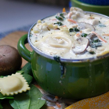 A full bowl of ravioli soup.