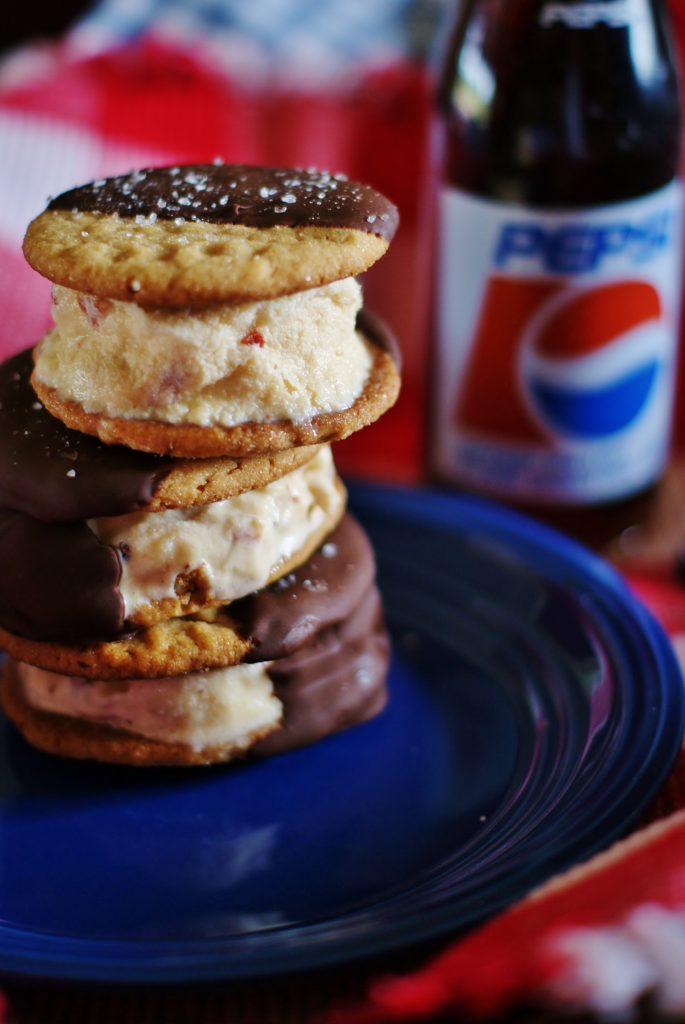 Chocolate Dipped Peanut butter cookies sandwich vanilla ice cream filled with bananas and bacon.