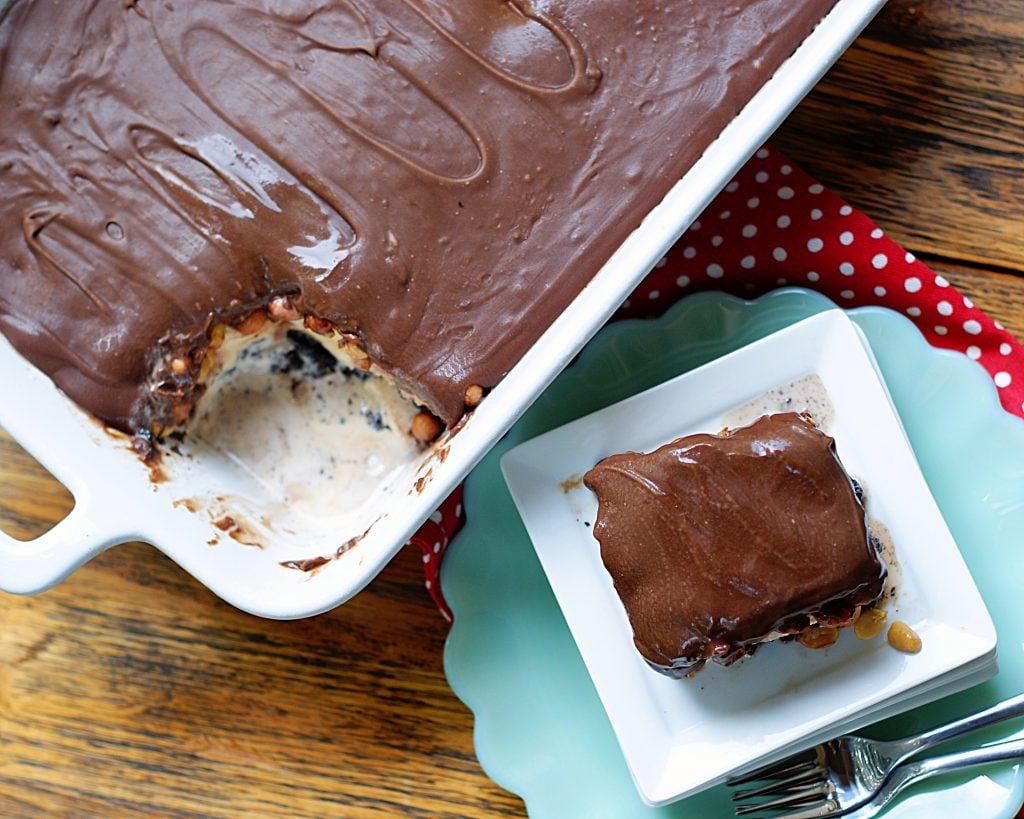 9x13 no bake buster bar ice cream dessert with a serving cut out to show how it should be cut and served.