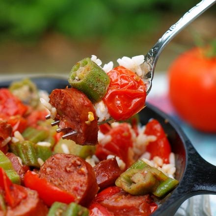 A forkful of Okra & Tomatoes with sausage.