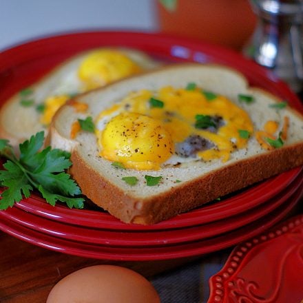 2 eggs in a basket on one plate.