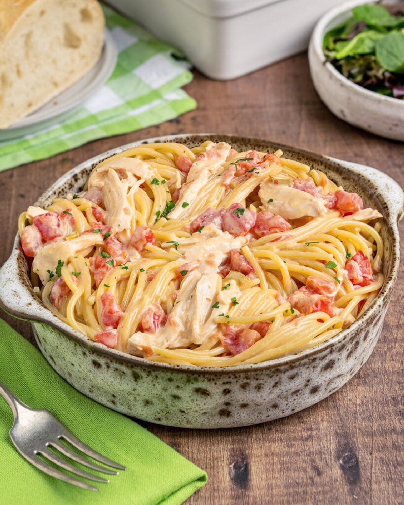 A bowl full of chicken spaghetti with Rotel tomatoes and Vleveeta cheese sauce as a dinner idea.