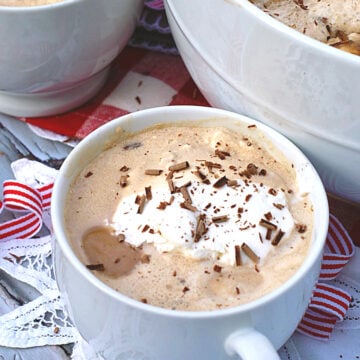 A cup of southern coffee punch topped with whipping cream and chocolate garnishes.