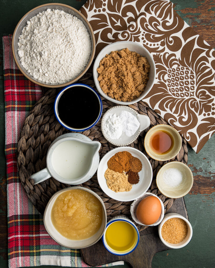 Homemade gingerbread muffin ingredients laid out as a visual representation of the written list to make it easier for readers to recognize what they'll need to make this recipe.
