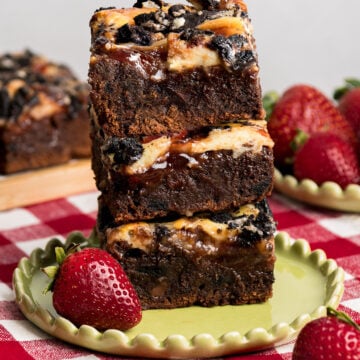 Strawberry Jam brownies with a cheesecake layer and Oreo topping.