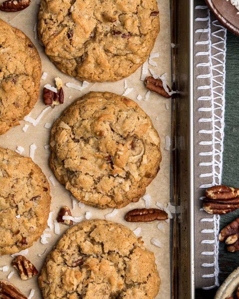 Chewy Coconut Cookie with pecans on  parchment paper.
