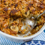 An upclose look at this french toast casserole with bananas and frosted corn flakes.