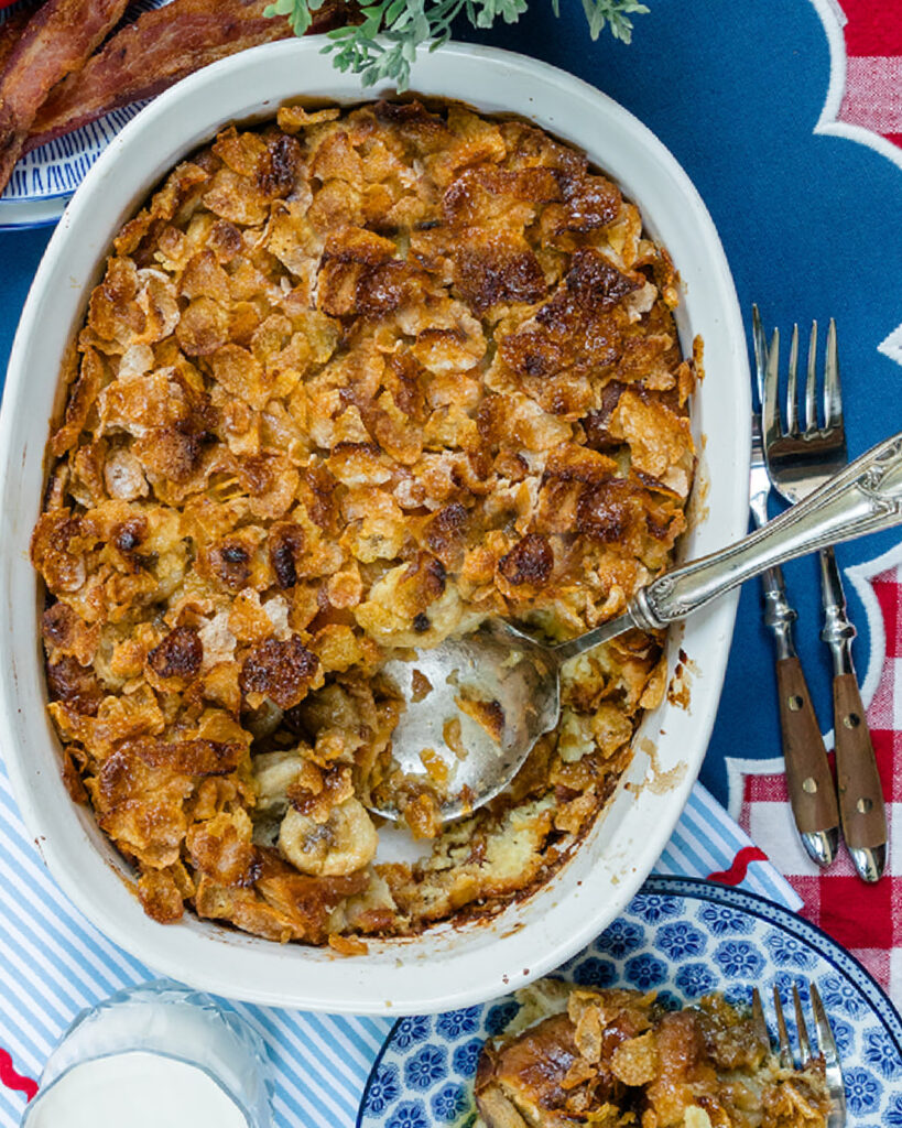 Looking down on a baked Banana French Toast Casserole with Frosted Flakes topping to show how it becomes golden brown when done.