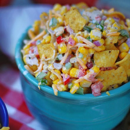 Potluck Frito Corn Salad in blue bowl