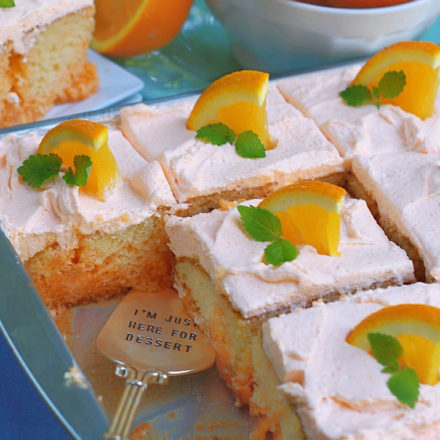 Best Orange Creamsicle Poke Cake in a sheet pan