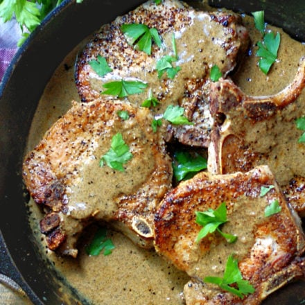 Pork Chops & Mustard Cream Sauce in a cast iron skillet