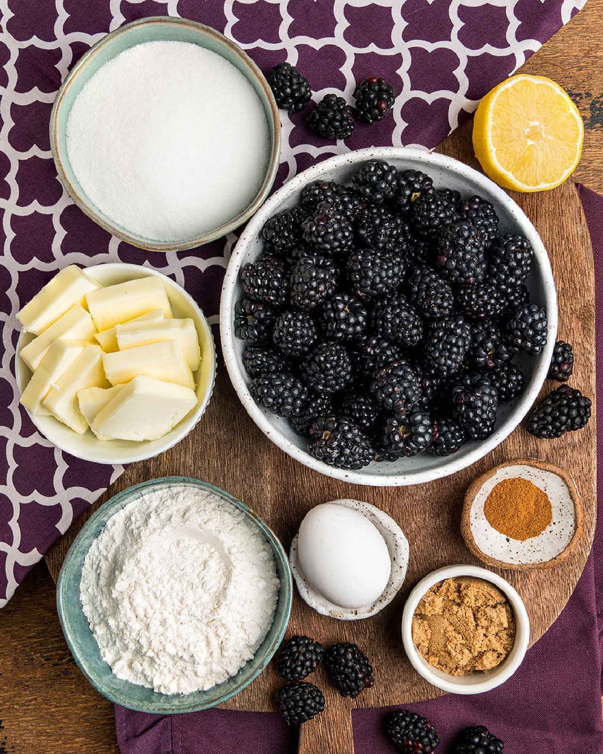 The simple ingredients needed to make southern blackberry cobbler in a cast iron.