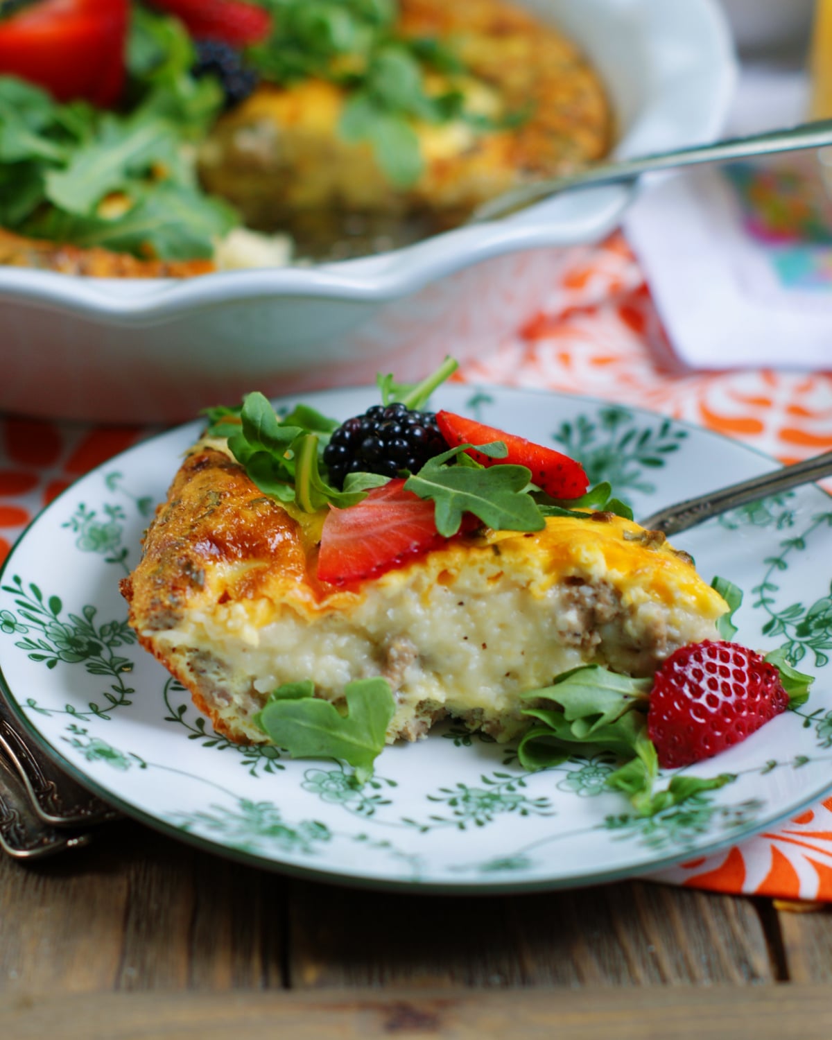 The side of a slice of grits quiche to show texture and ingredients.