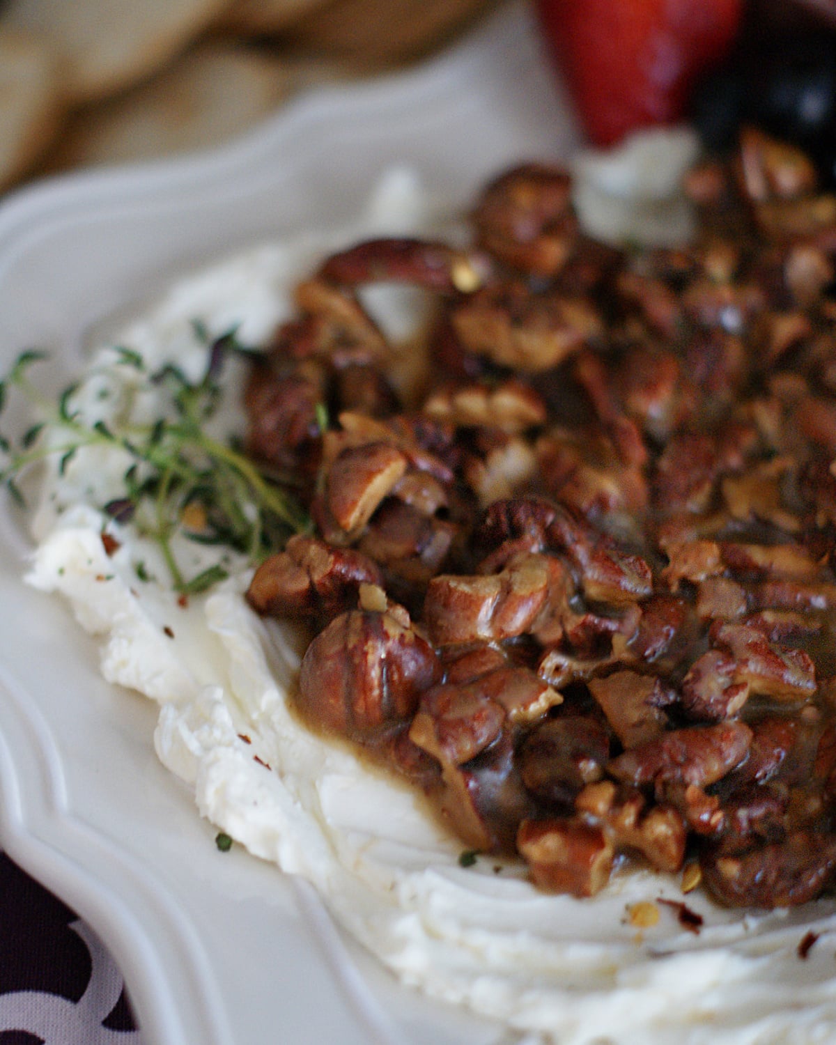 Upclose look at this appetizer cheese spread with pralined pecans to show texture.