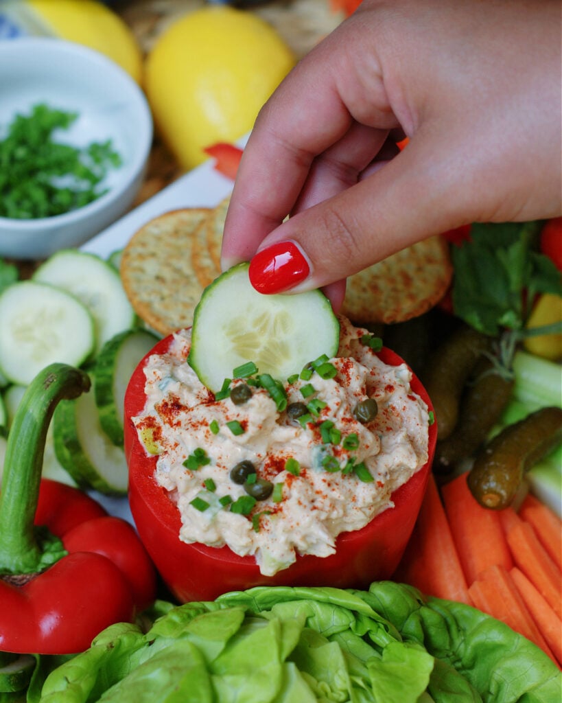 The best smoked tuna dip recipe that anyone can make served in a red bell pepper and dipped with fresh vegetables.