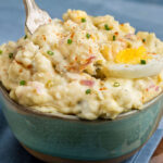A serving of old fashioned deviled egg potato salad, a southern potato salad recipe, to show actual texture of the finished recipe.