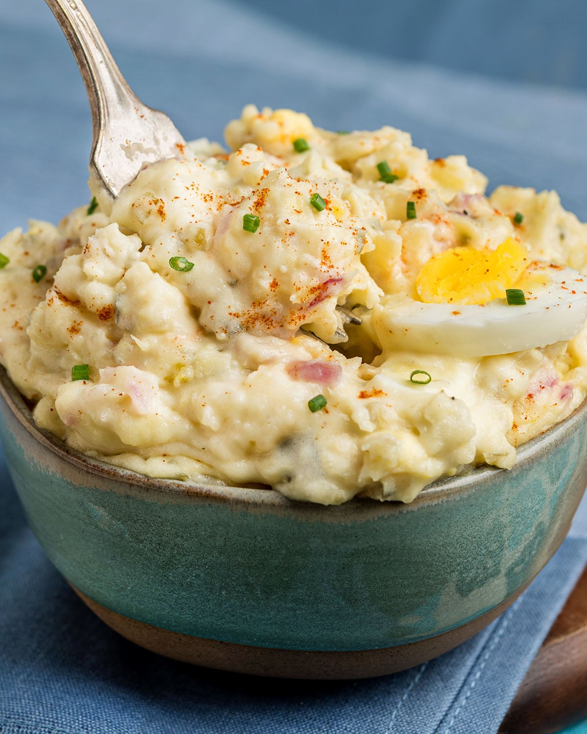 A serving of old fashioned deviled egg potato salad, a southern potato salad recipe, to show actual texture of the finished recipe.