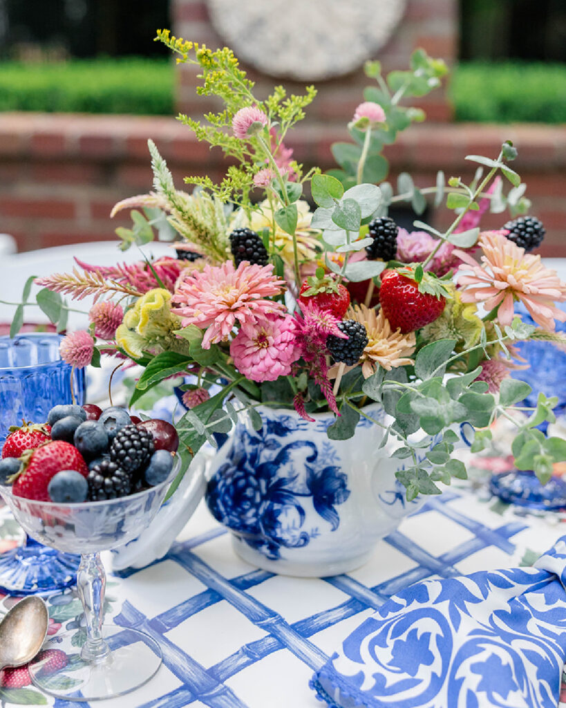 Adding berries on skewers is a simple way to make your floral centerpiece tie in with the theme of your pary.