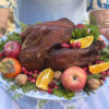 A Thanksgiving turkey on a large serving platter as a serving idea.